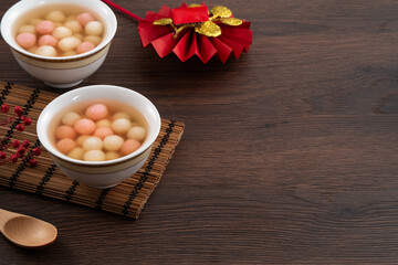 Fototapeta premium Red and white tangyuan with syrup soup.