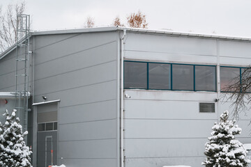 A Large Industrial Warehouse Complex Covered in Snow Showcasing the Modern Architecture and Exterior Design