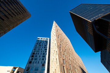 Low angle view of modern office buildings in the financial area of Poblenou in the city of Barcelona in Catalonia in Spain