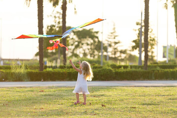 little girl flying a kite