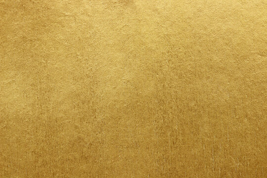Gold paper texture background. gold wall background