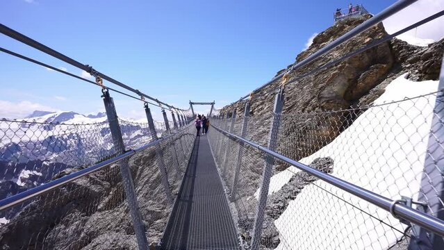 Titlis bridge walk. Mount Titlis glacier panorama of Uri Alps in Switzerland. Swiss Alps. popular tourism destination from Lucerne.