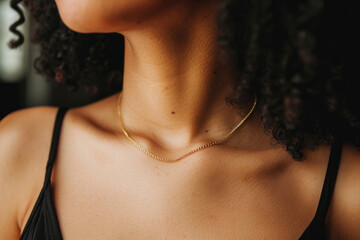 The elegance of a woman's neck adorned with a stylish gold chain necklace