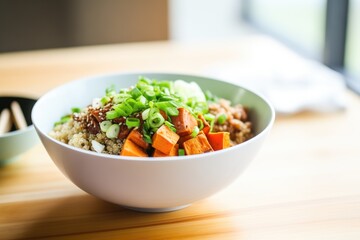 sweet potato and quinoa bowl with green onions