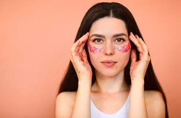 Fototapeta premium Glad female with eye patches