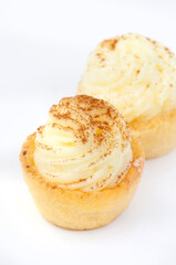 Mini South African milk tart cups isolated on white with copy space and selective focus