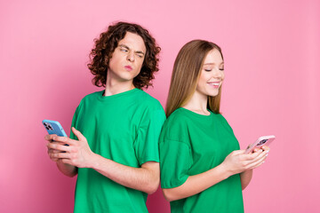 Photo youth couple relationships problems using smartphone looking jealousy dislike chatting...