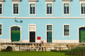 Fototapeta na wymiar Doca Da Caldeirinha building with blue facade - Portuguese Navy administration.