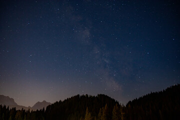 starry sky in summer mountains and milky way Trentino Alps - 715395275