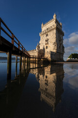 Fototapeta na wymiar Belem Tower With Mirror Reflection In Water In Lisbon, Portugal