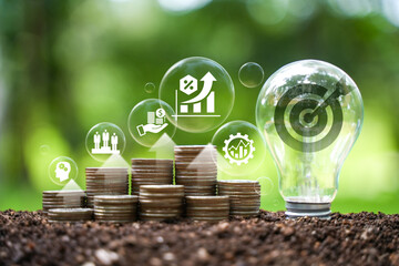 Implementation of the New Year goal plan 2024. Wooden cube with year 2024 and goal icons on green background. Business plan and development to achieve goals Target achievement.