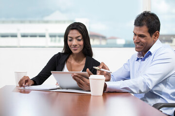 Indian business colleagues using a digital tablet