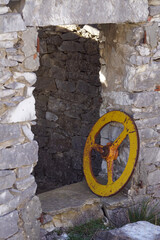 ancient iron wheel on the window