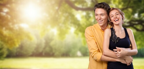 Happy young cute couple have fun outdoors