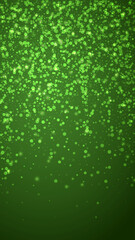Snowy christmas background. Subtle flying snow flakes and stars on christmas green background. Delicate sweet snowy christmas. Vertical vector illustration.