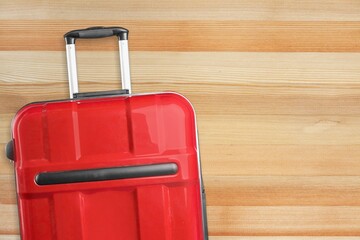 Classic travel suitcase on pastel background