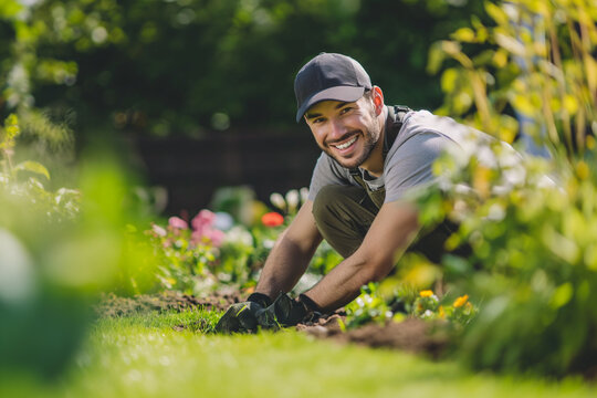 Photo of happy male working in the garden