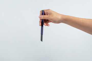 Hand Holding cutter on white Background