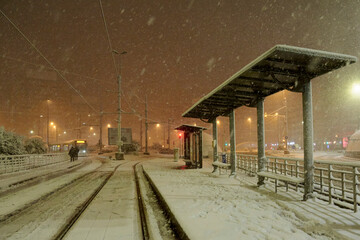 People in traffic through snow in Bucharest, Romania,