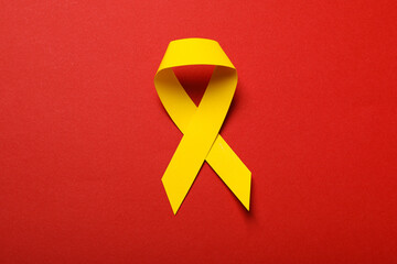 Yellow paper ribbon on a red background