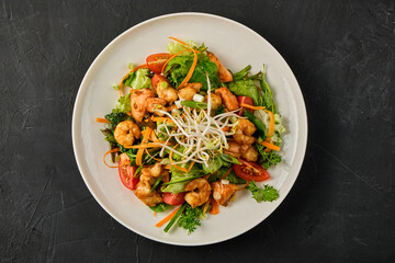 Close up photo of Seafood salad with shrimp, salmon, and fresh vegetables