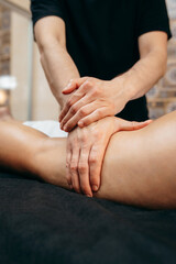 Male hands doing anti-cellulite massage