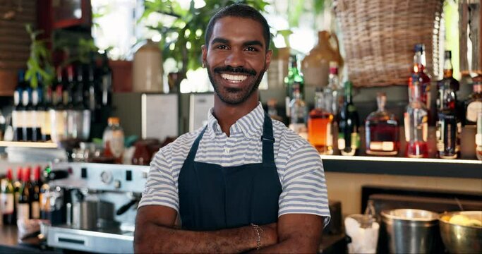 Welcome, coffee shop and confident portrait of man at bar with smile, waiter or manager at restaurant startup. Bistro, service barman and happy small business owner at cafe counter with arms crossed.