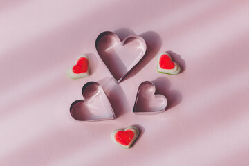 Valentine's day concept with red hearts and candies on wooden table