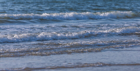 Waves seen on the beach just before sunset
