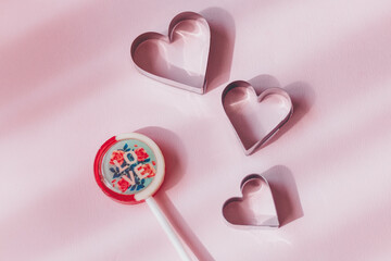 Valentine's day concept with red hearts and candies on wooden table