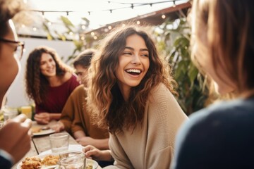 Happy woman having fun with friends at restaurant