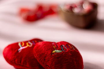 Valentine's day concept with red hearts and candies on wooden table