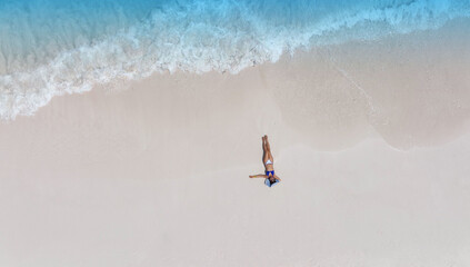 Fresh of summer with young woman  relaxation  as lying on the beach  in Maldives - Powered by Adobe