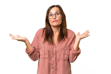 Middle-aged caucasian woman over isolated background having doubts while raising hands