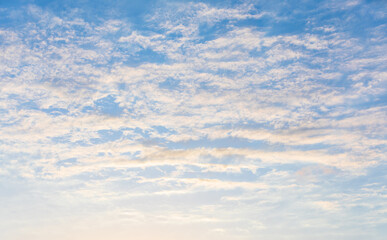Naklejka na ściany i meble Sunset, orange clouds in the blue sky