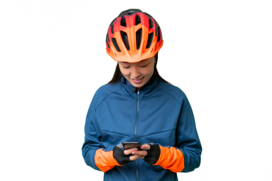 Young cyclist woman over isolated chroma key background sending a message with the mobile