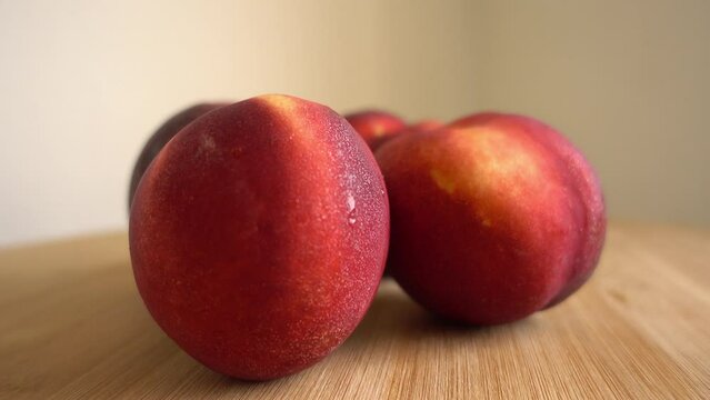 Freshly picked ripe peaches Rotating