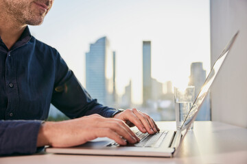 Mature businessman working on laptop