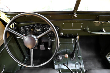 retro car interior. Vintage dashboards. Luxury leather steering wheel. Auto controls.
White interior. Car chairs and seats. Car sofa. Back and front row. Interior and door trim. Classic look