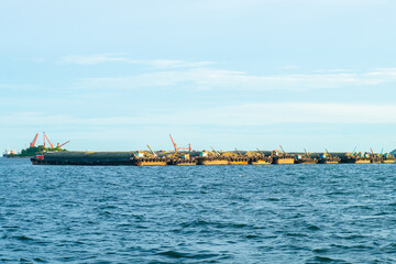 Shipping boat transport on sea bay shipping port city background