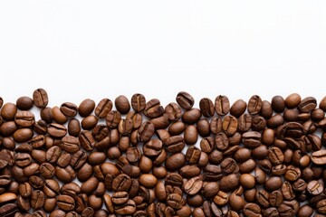 Fototapeta premium Top view of roasted coffee beans isolated on white background with copy space. Coffe beans with white space