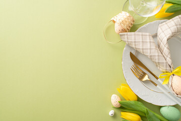 Easter Feast Display: Top view of a table adorned with bunny ear napkin, cutlery, wine glass,...