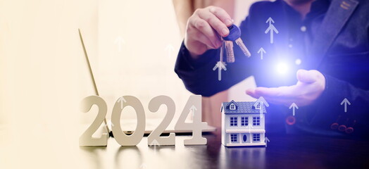 businessman buying property in 2024 using digital technology and laptop computer. Finance and trade concept 2024. Double exposure