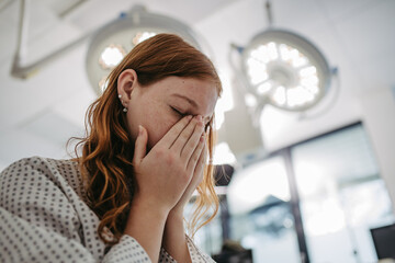 Close up of scared teenage patient, waitng for test results. Anxiety, worry and loneliness of...