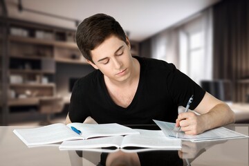 teen student learning and writing notes
