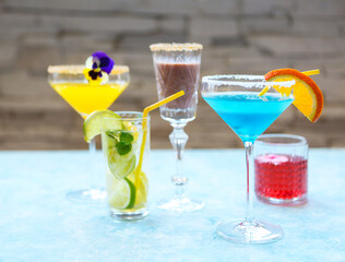 Alcohol cocktails on the turquoise background