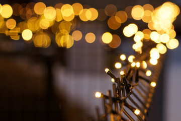 Golden christmas lights on fence