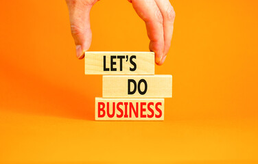 let is do business symbol. Concept words let is do business on beautiful wooden blocks. Beautiful...