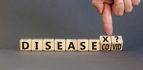 Disease X after covid symbol. Turned cubes and changed the word Disease COVID to Disease X. Beautiful grey table grey background. Doctor hand. Medical, Disease X after covid concept. Copy space.