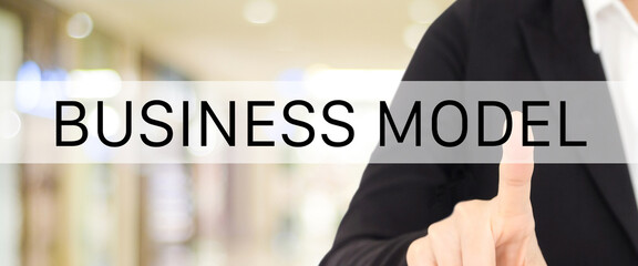 Business model banner, Businesswoman hand pointing on search bar with business model word over blur office background
